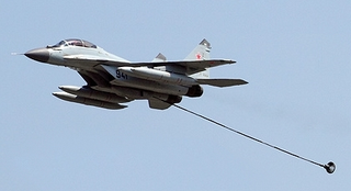 Illustration for article titled Taking Off In A MiG-29K From A Carrier At Night Is A Fiery Thrill